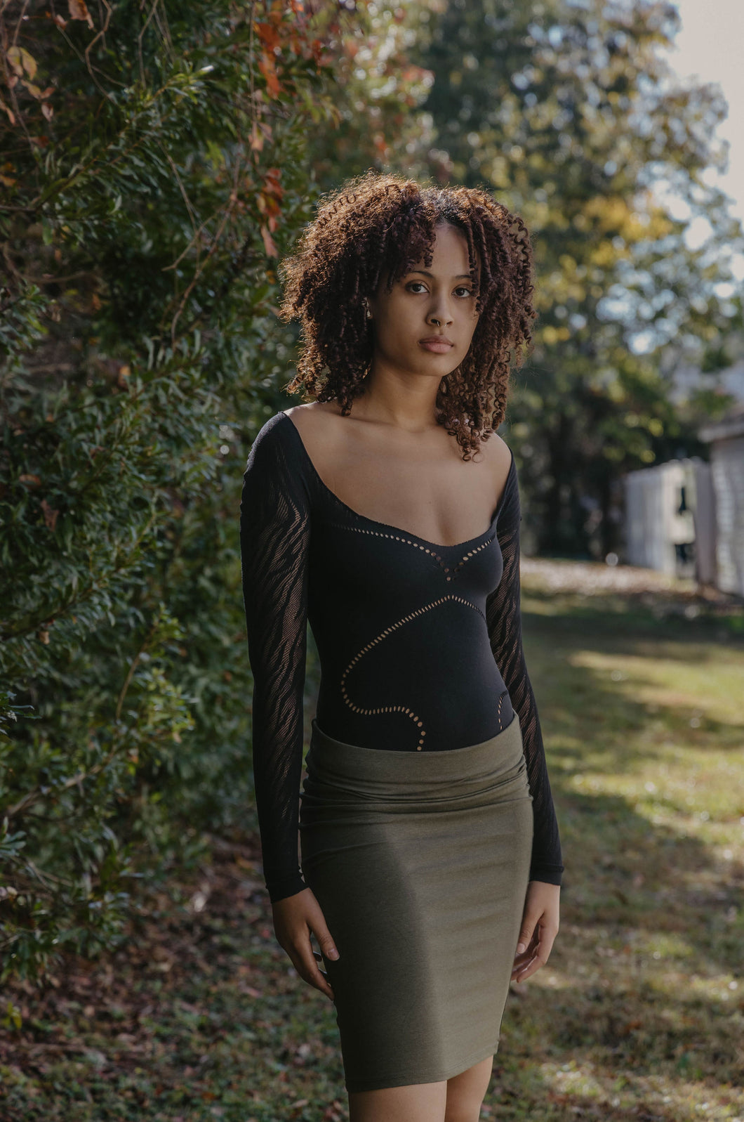 black bodysuit and green shirt from peakechic