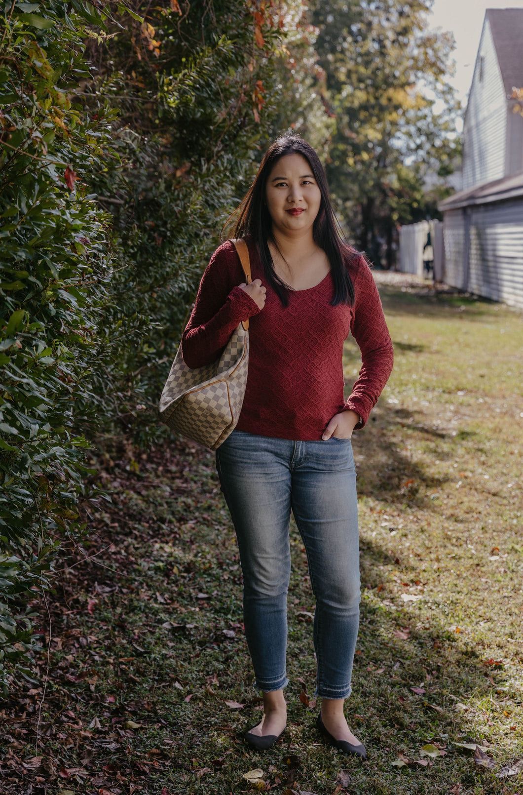 red jacquard top with jeans and a LV bag from Peake Chic 